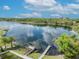Aerial view of a peaceful lake with private docks and lush greenery at 1917 S Lakemont Ave, Winter Park, FL 32792
