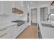 Modern kitchen with white cabinets, stainless steel appliances, and gas cooktop at 1917 S Lakemont Ave, Winter Park, FL 32792