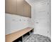 Convenient mudroom with built-in bench seating and storage cabinets at 1917 S Lakemont Ave, Winter Park, FL 32792