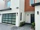 Modern home exterior with brick and glass garage door at 1917 S Lakemont Ave, Winter Park, FL 32792