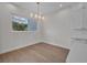 Bright dining area with hardwood floors and a modern chandelier at 1917 S Lakemont Ave, Winter Park, FL 32792