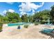 Community pool area with seating and surrounding landscaping at 700 Melrose Ave J 1 Ave # J1, Winter Park, FL 32789
