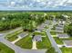 Aerial view showcasing a single-Gathering home and surrounding community at 25 Bahia Crse, Ocala, FL 34472
