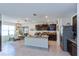 Open kitchen with an island, dark cabinets, and stainless steel appliances at 25 Bahia Crse, Ocala, FL 34472