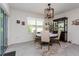 Bright dining area with a charming table and chairs, and access to the backyard at 25 Bahia Crse, Ocala, FL 34472