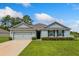 Newly built home with gray siding and a two-car garage at 25 Bahia Crse, Ocala, FL 34472
