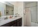 Bathroom with double vanity and shower/tub combo at 25 Bahia Crse, Ocala, FL 34472