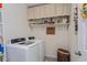Laundry room with washer, dryer, and shelving at 25 Bahia Crse, Ocala, FL 34472