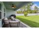 View of backyard with patio and grassy area at 25 Bahia Crse, Ocala, FL 34472