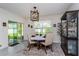 Bright dining area with a charming table and chairs, and access to the backyard at 25 Bahia Crse, Ocala, FL 34472