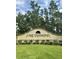 Lake Diamond community entrance with a landscaped median at 25 Bahia Crse, Ocala, FL 34472