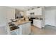 Island kitchen with granite countertops and stainless steel appliances at 2892 Waterlily Way, Poinciana, FL 34759