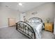 Charming bedroom with a metal bed frame and light wood dresser at 919 Braewood Dr, Clermont, FL 34715