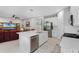 Open kitchen boasting a large island, stainless steel appliances, and white cabinetry at 919 Braewood Dr, Clermont, FL 34715