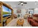 Spacious living room featuring comfortable seating, large TV, and built-in shelving at 919 Braewood Dr, Clermont, FL 34715
