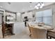 Open concept kitchen with an island, white cabinets, and stainless steel appliances at 919 Braewood Dr, Clermont, FL 34715