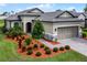 One story home with attractive landscaping and a two-car garage at 919 Braewood Dr, Clermont, FL 34715