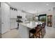 Modern kitchen featuring white cabinets, an island, and stainless steel appliances at 919 Braewood Dr, Clermont, FL 34715