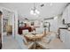 Kitchen with an eat-in area, white cabinets, and a view into the living room at 919 Braewood Dr, Clermont, FL 34715