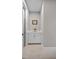 Clean bathroom vanity with white cabinets and a light beige floor at 919 Braewood Dr, Clermont, FL 34715