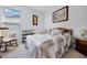 Bedroom with a wooden bed frame, a rocking chair, and a window at 919 Braewood Dr, Clermont, FL 34715