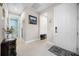 Light and bright entryway with tile flooring and access to bathroom at 919 Braewood Dr, Clermont, FL 34715