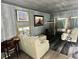 Spacious living area with two sofas and a game table at 195 Railroad Ave, Osteen, FL 32764