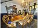 Elegant dining room with a large wooden table and chandelier at 195 Railroad Ave, Osteen, FL 32764