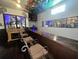Long bar with seating and a decorative fireplace at 195 Railroad Ave, Osteen, FL 32764