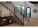 Modern staircase with metal railing and light wood at 840 W Comstock Ave, Winter Park, FL 32789