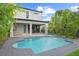 Modern kidney-shaped pool surrounded by a gray paver deck at 840 W Comstock Ave, Winter Park, FL 32789