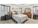 Comfortable bedroom with a queen-size bed and dresser at 13530 Hawk Lake Dr, Orlando, FL 32837