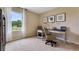 Home office with desk and chair, featuring large window at 2888 Waterlily Way, Poinciana, FL 34759