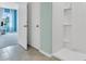 Clean bathroom with a shower and neutral color palette at 2888 Waterlily Way, Poinciana, FL 34759