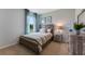 Cozy bedroom featuring a wood bed frame and built-in shelving at 2888 Waterlily Way, Poinciana, FL 34759