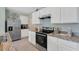 Modern kitchen with stainless steel appliances and granite countertops at 2888 Waterlily Way, Poinciana, FL 34759