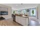 Modern kitchen with stainless steel appliances and granite countertops at 2888 Waterlily Way, Poinciana, FL 34759