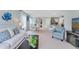 Open living room with views into the kitchen and dining area at 2888 Waterlily Way, Poinciana, FL 34759