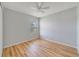Bright bedroom with hardwood floors and ceiling fan at 2839 Boating Blvd, Kissimmee, FL 34746