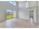 Bright living room with high ceilings, sliding glass doors, and backyard view at 2839 Boating Blvd, Kissimmee, FL 34746