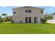 Large backyard with a grassy area behind a two-story house at 2839 Boating Blvd, Kissimmee, FL 34746