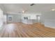 Large loft area with light hardwood flooring and ceiling fan at 2839 Boating Blvd, Kissimmee, FL 34746