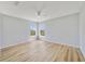 Well-lit bedroom with hardwood floors and dual windows at 2839 Boating Blvd, Kissimmee, FL 34746