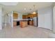 Open kitchen features an island, stainless steel appliances, and wood cabinets at 2839 Boating Blvd, Kissimmee, FL 34746