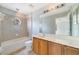Clean bathroom with a shower/tub combo, vanity with wood cabinets, and tile flooring at 2839 Boating Blvd, Kissimmee, FL 34746
