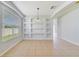 Bright dining room features built-in shelving and tile flooring at 2839 Boating Blvd, Kissimmee, FL 34746