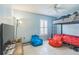 Bedroom featuring a bunk bed, beanbag chairs, and a TV at 3090 Tioga Ter, Deltona, FL 32738