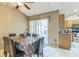 Dining area with a table and chairs, and access to the kitchen and patio at 3090 Tioga Ter, Deltona, FL 32738