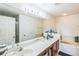 Bathroom boasts double sinks, garden tub, and separate shower at 14175 Turning Leaf Dr, Orlando, FL 32828