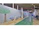 Building hallway with shuffleboard and beach mural at 5207 S Atlantic Ave # 1226, New Smyrna Beach, FL 32169